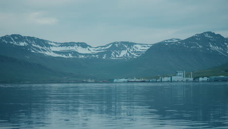 static shot of neskaupstaður landscape, east iceland, water, ice, mountains, reflections