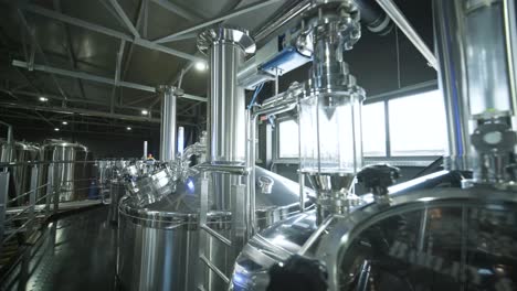 modern craft brewery. craft beer production. modern equipment in brewery, metal tanks, alcoholic drink production