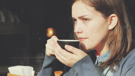 woman drinking coffee in cafe