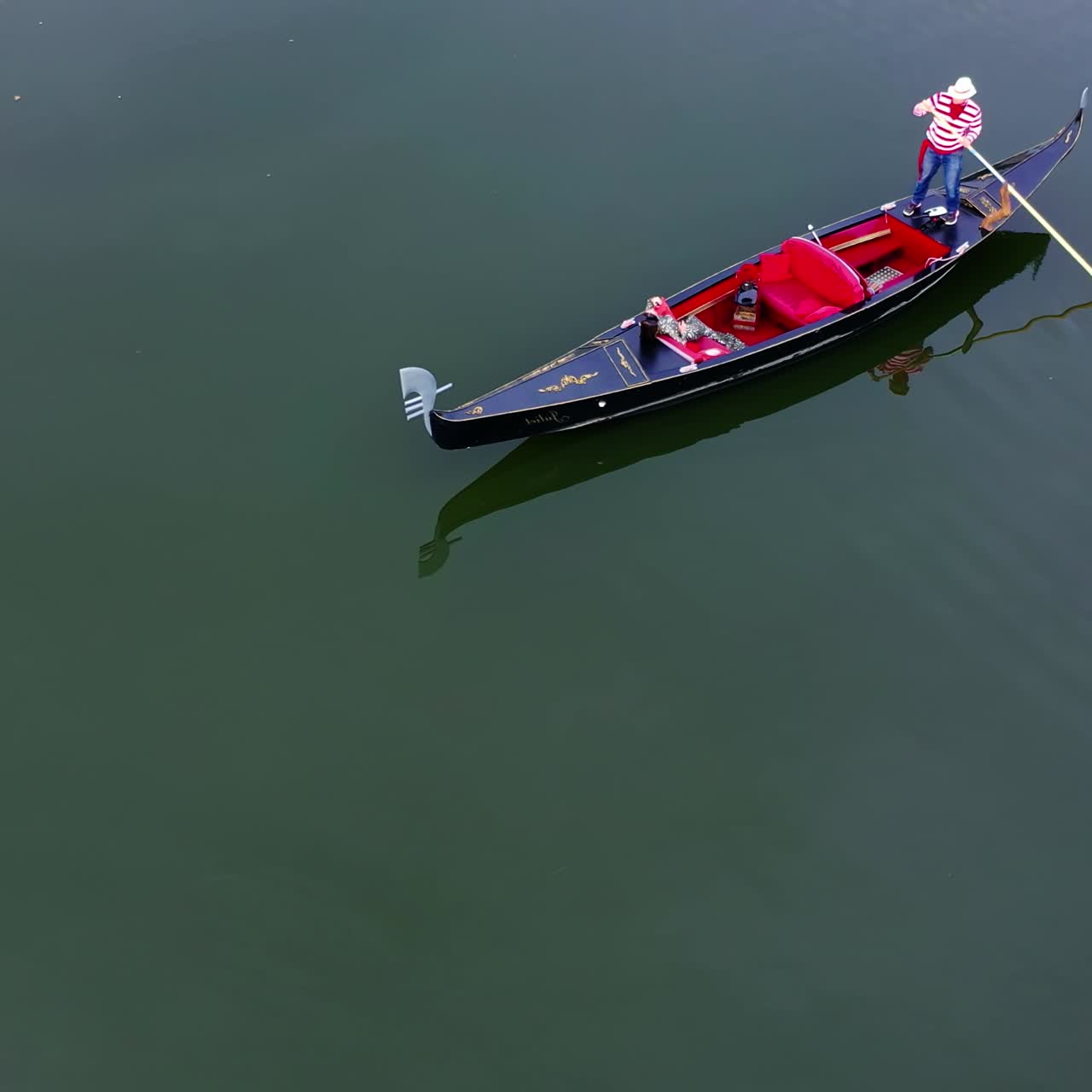 Gondolier putting gondola through river