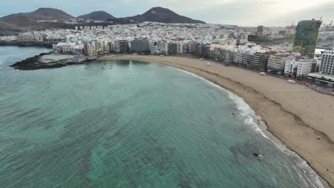 aerial journey over las canteras beach at dawn in las palmas, gran canaria