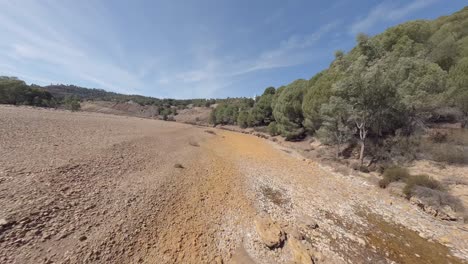 fast dynamic fpv flight down dry riverbed of