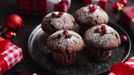 christmas chocolate delicious muffins served on black ceramic plate