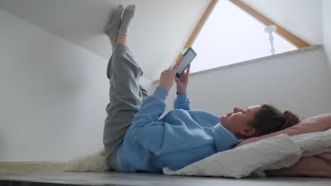 woman relaxing with e-reader