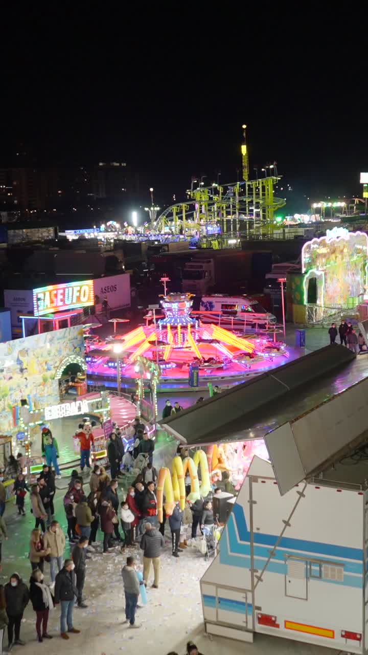 Vibrant Nighttime Scene at a Lively Amusement Park