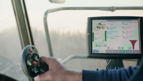 Info screen inside combine harvester with lots of data