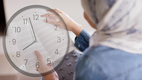 animation of clock over biracial woman in hijab reading book