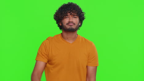 upset handsome man guy in shirt showing thumbs down sign gesture disapproval dissatisfied dislike