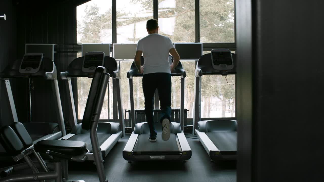 Man Working Out in Empty Gym