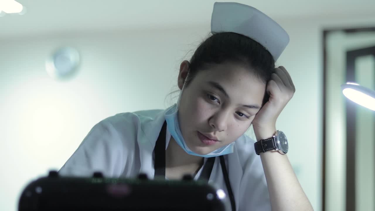 Exhausted Nurse Working Late at Night
