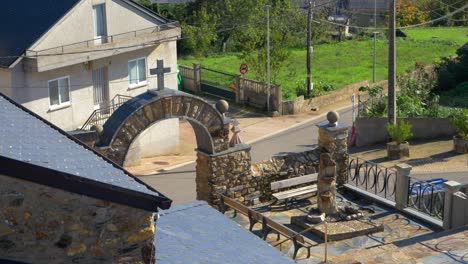 side view of santa mariña de rubiá church facade, showing walls, windows, and stone texture in galicia