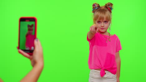 Happy-funky-blogger-child-kid-girl,-recording-funny-dancing-video-on-smartphone-for-social-network