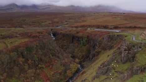 Aerial-Drone-flyover-of-Lealt-Fall-waterfall-in-Skye-Scotland-Autumn