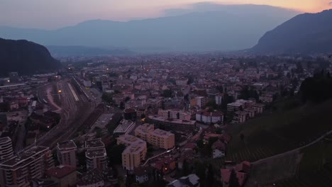 bolzano city at sunset in the south tyrol province of northern italy. aerial drone shot