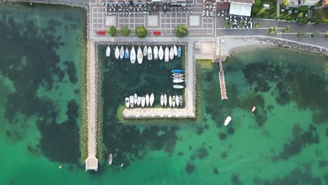 Boats-For-Rent-Docked-On-The-Marina-In-Cisano,-Lake-Garda,-Italy