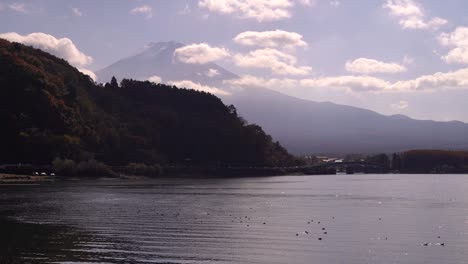 beautiful scenery at lake kawaguchiko on partially cloudy day with mount fuji