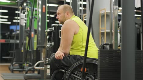 man with disabilities training in the gym of rehabilitation center