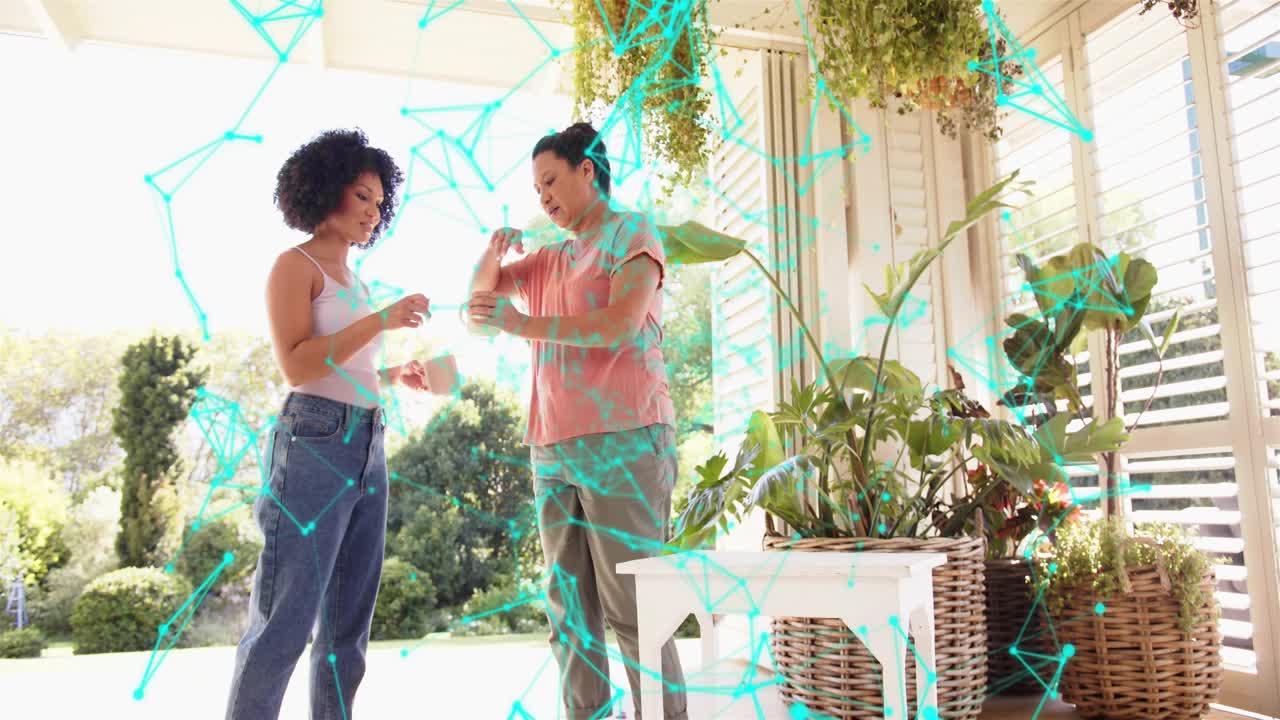Mother offering white mug daughter reaching sharing drink by home plants under turquoise overlay