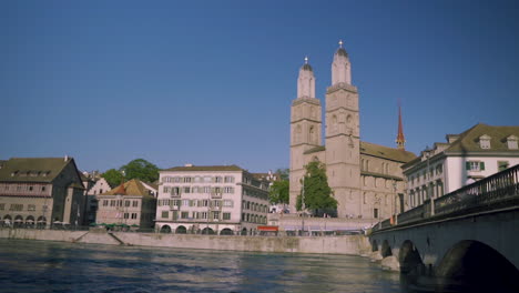 day view of historic zurich city center with famous fraumunster and grossmunster churches and river limmat at lake zurich, canton of zurich, switzerland