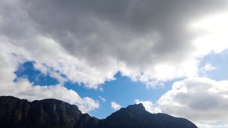 Fluffy-clouds-gently-exploding-in-a-brilliant-blue-sky