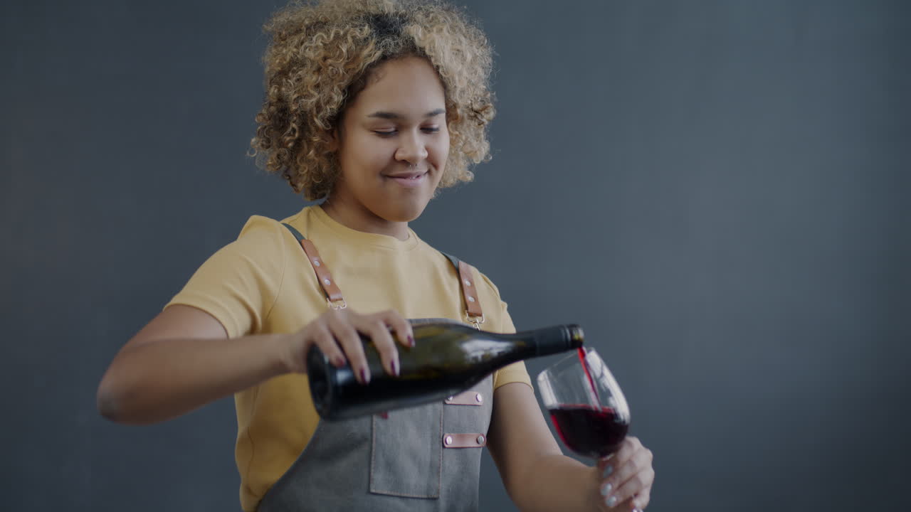 Woman Pouring Red Wine