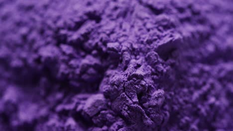 Video-of-close-up-of-purple-powder-with-copy-space