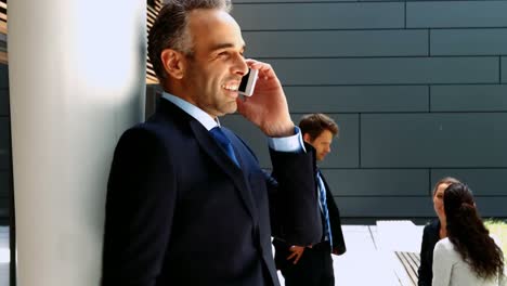 Businessman-talking-on-mobile-phone