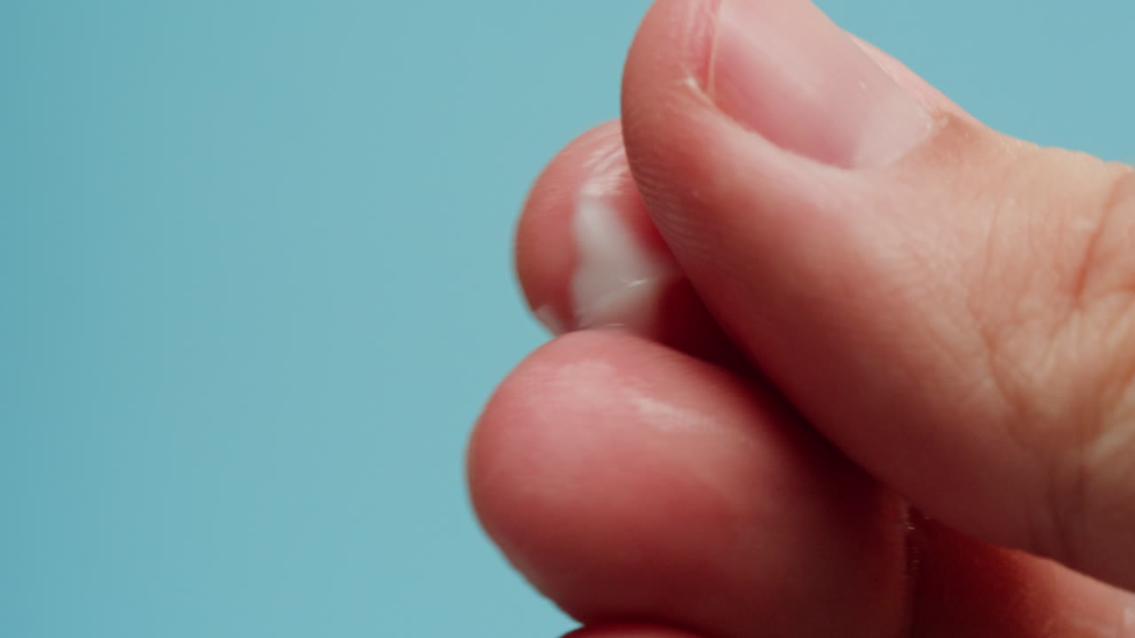 Applying lotion to fingers