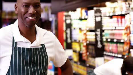 Portrait-of-male-staff-standing-with-hands-on-hips