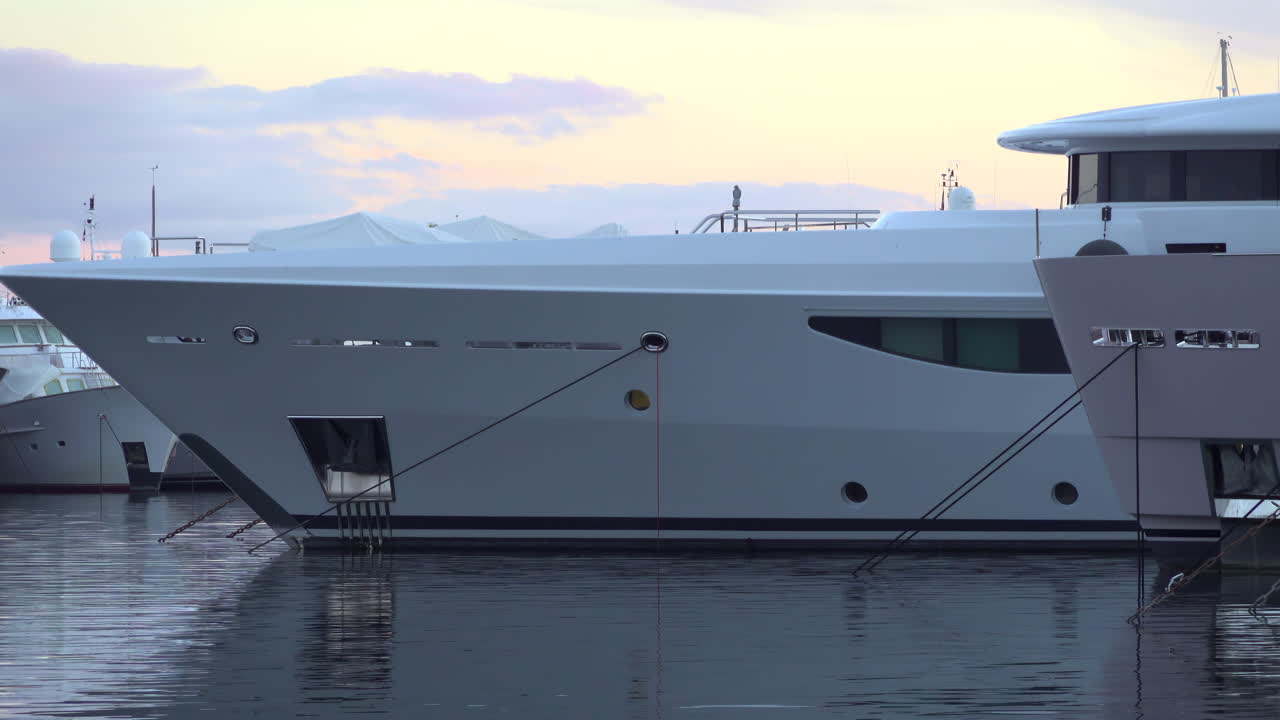 Antibes, France - March 21, 2025: Multiple boats docked in the port in the evening