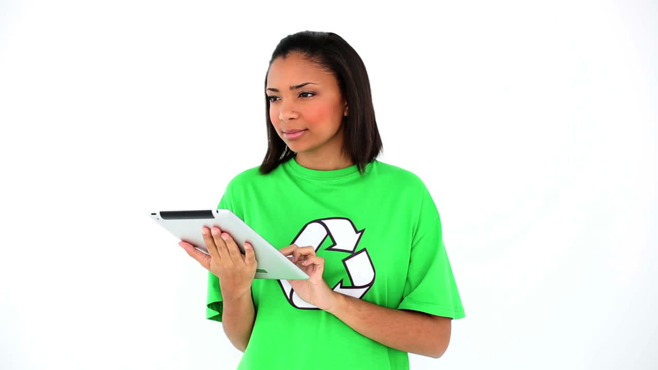 Cute thinking environmental activist working with her tablet 
