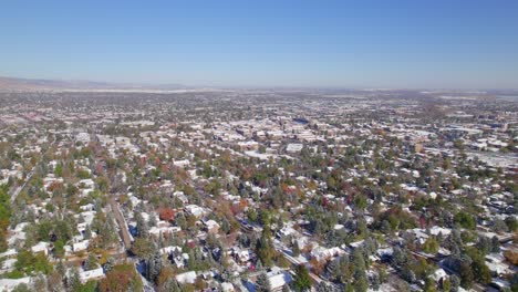 neighborhood around university of colorado boulder on a fall day with snow