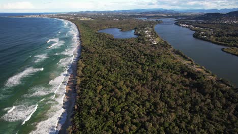 dreamtime beach and tweed river in fingal head, nsw, australia - drone shot