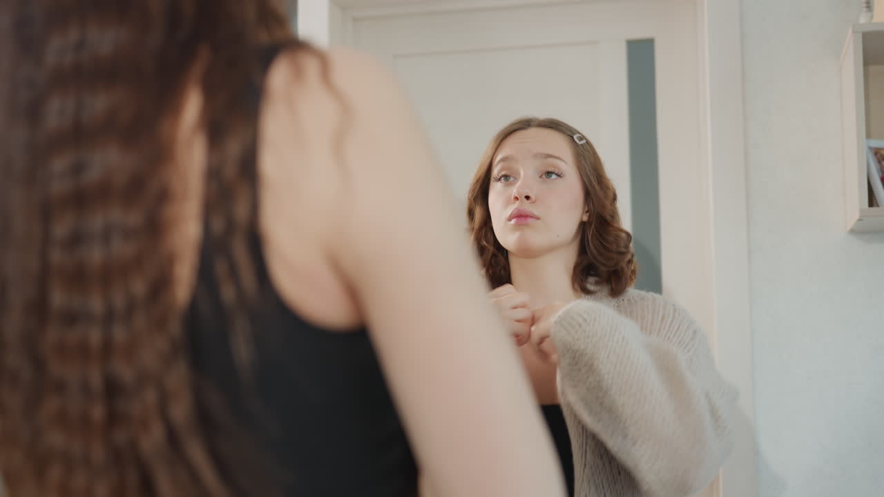 Two Friends Smile Brightly At Bathroom Mirror, Enjoying Cheerful Laughter Together In Bright Bathroom Setting, Women Delight In Joyful Moment Of Shared Laughter Reflected In Bathroom Mirror