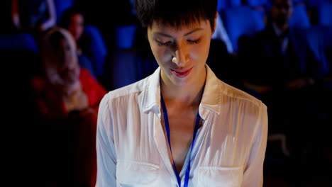 young asian businesswoman using digital tablet during business seminar in auditorium 4k