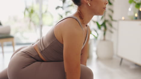 woman practicing yoga at home