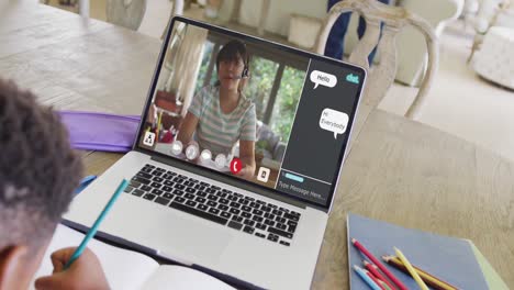 composition of asian boy on laptop online learning with biracial schoolgirl