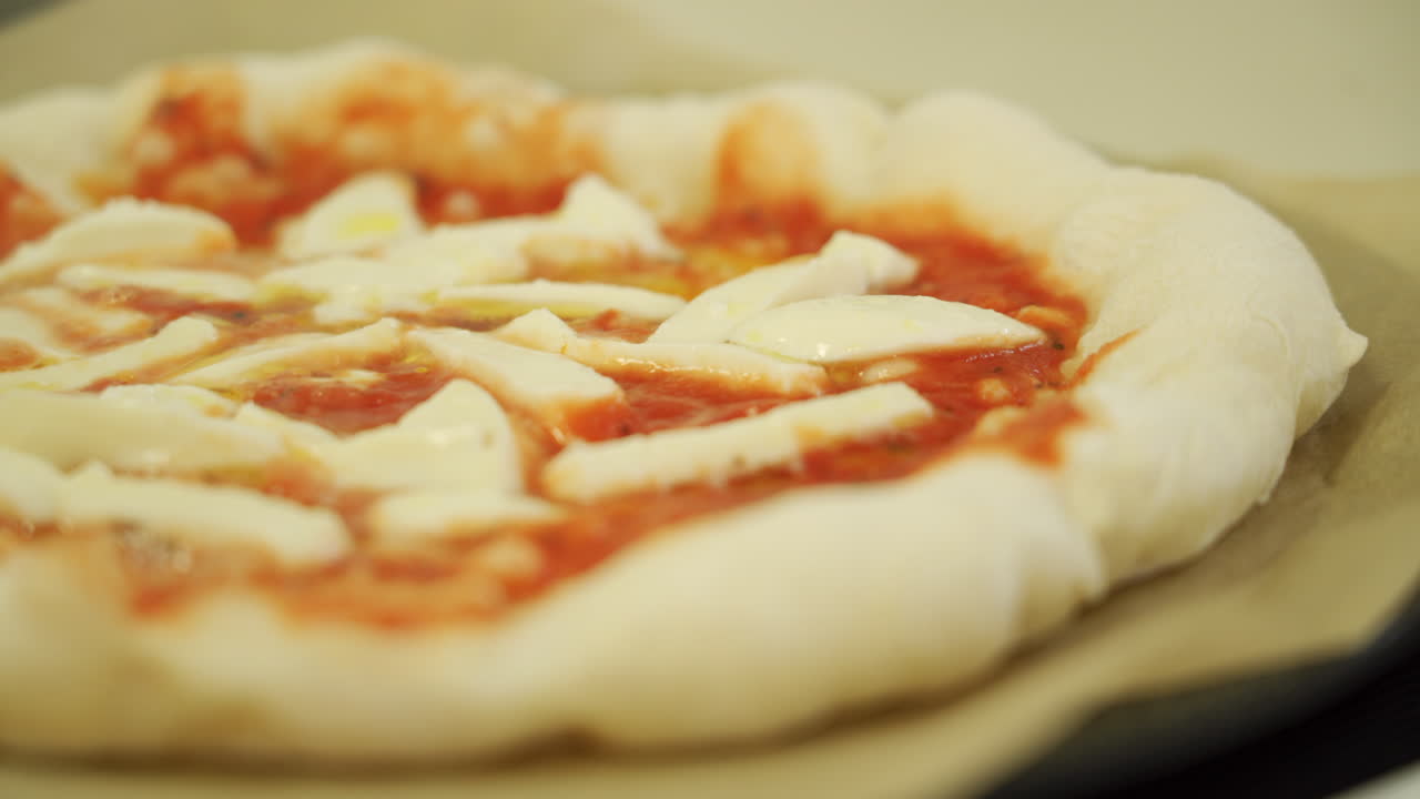 A delicious Margherita pizza while cooking, sizzling and bubbling