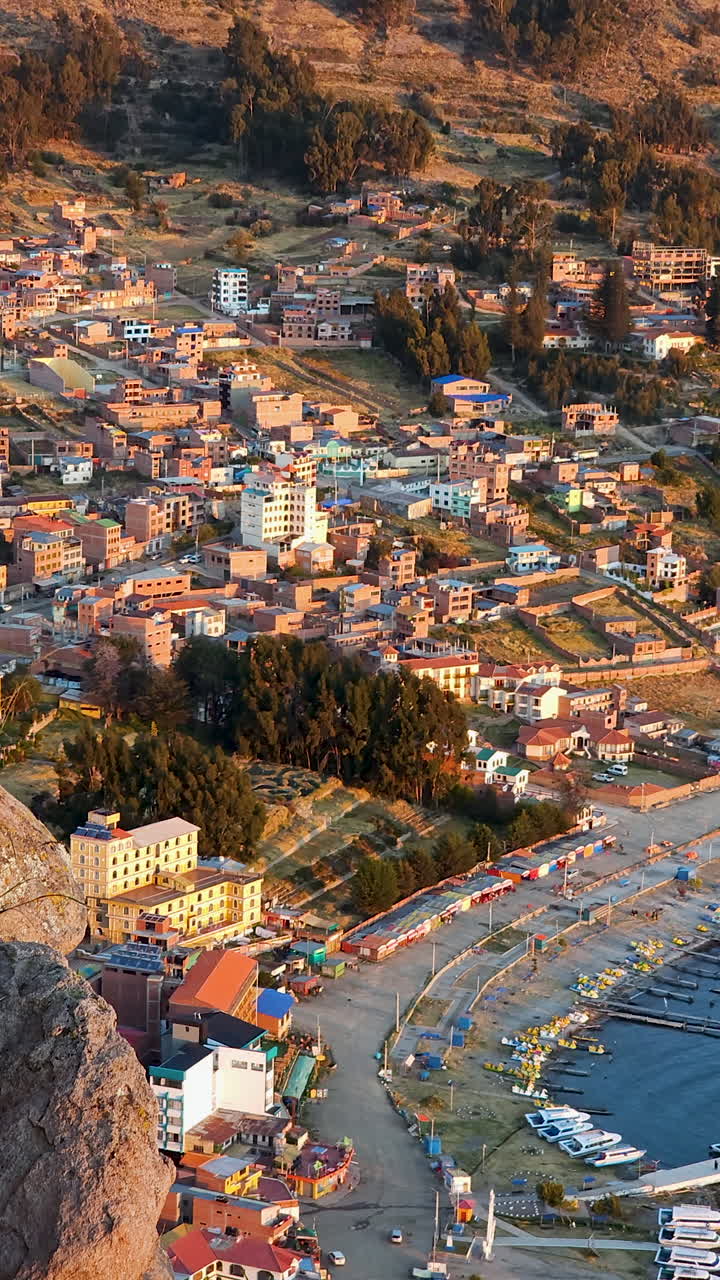 Experience a stunning vertical aerial view of Copacabana, Bolivia, as seen from the top of Cerro Calvario
