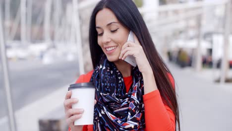 fashionable young woman listening to a call