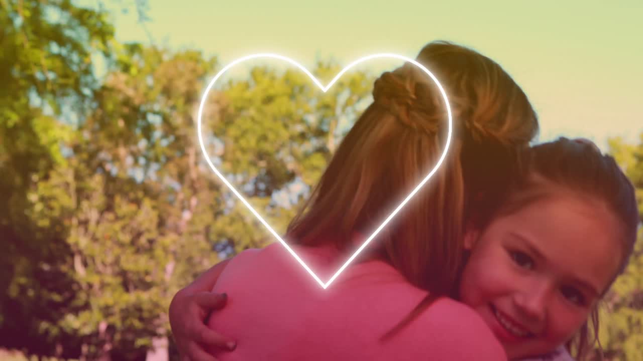 공원에서 딸과 함께 행복한 백인 어머니에 대한 심장의 애니메이션