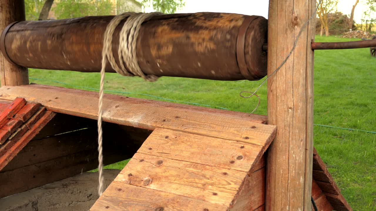 bucket quickly falls down the well, the rope uncoils