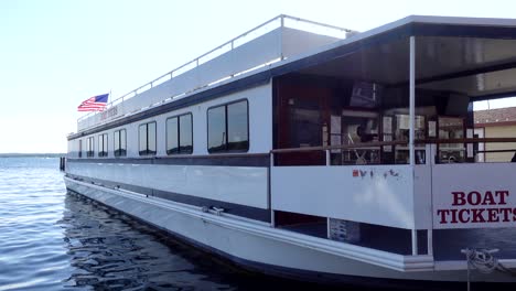 a boat waiting for riders on a pier, no persons