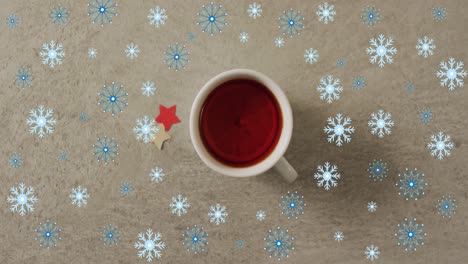 animación de la nieve cayendo sobre la taza de té de navidad.