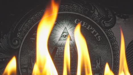 pyramid on a banknote of 1 us dollars bill with glowing freemasons eye on top on fire in flames. conceptual 4k slow motion raw video. financial crisis idea, conspiracy theory.