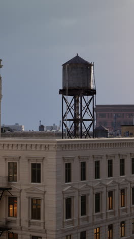 water tower on a building rooftop in new york city