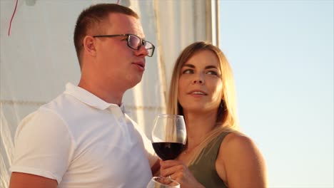 couple enjoying wine on a sailboat