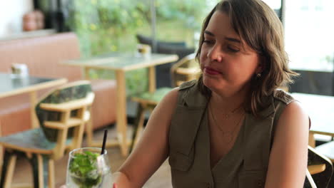 latin woman with friend at the cafeteria