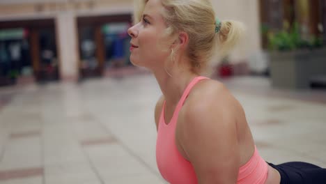 closeup of a yogi woman performing bending asana outdoors