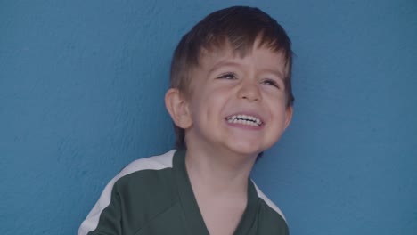 close-up of a happy boy smiling with excitement, capturing a natural and joyful moment filled with pure childhood happiness and emotion